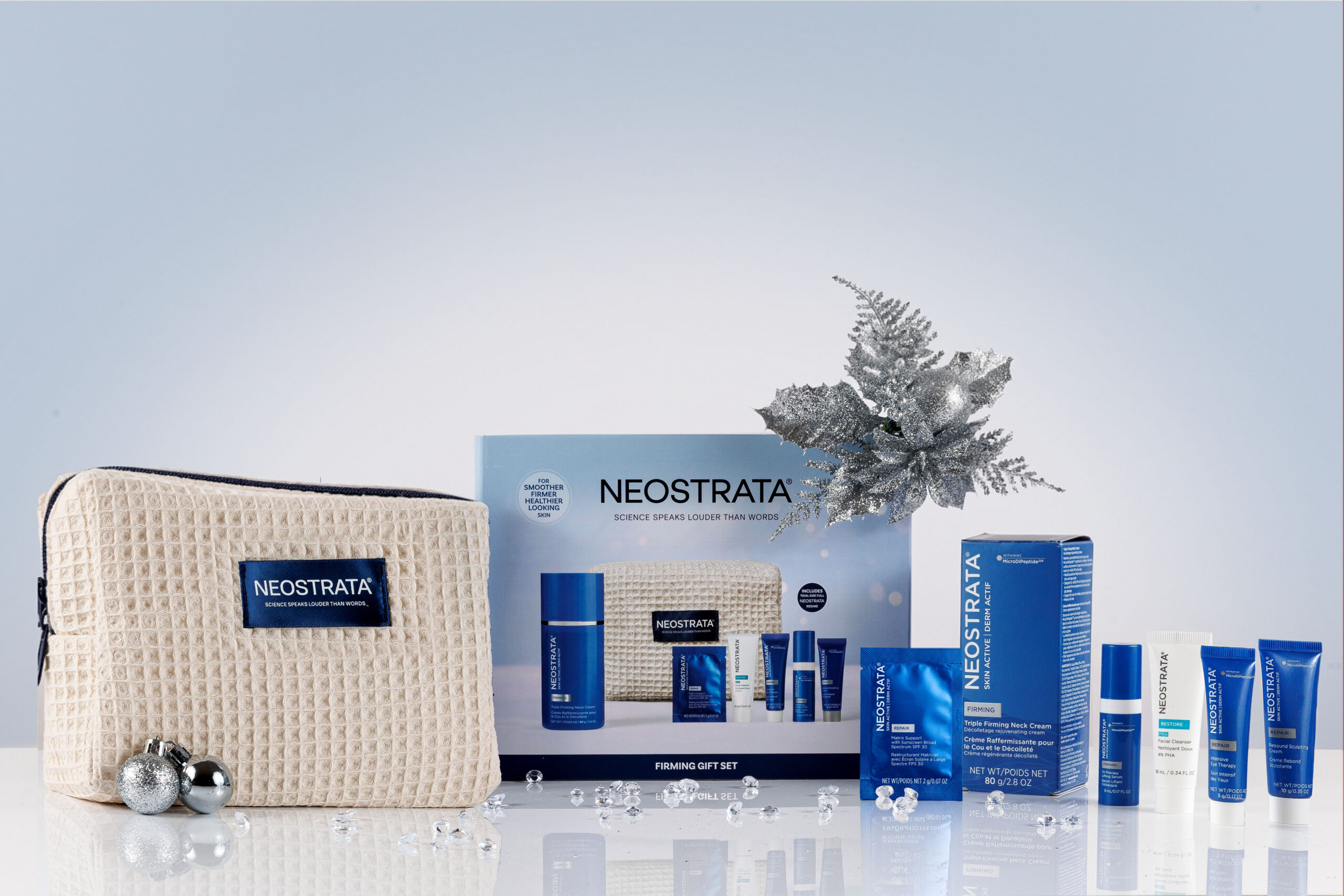 NEOSTRATA Firming Gift Set with skincare products, beauty bag and silver Christmas decorations
