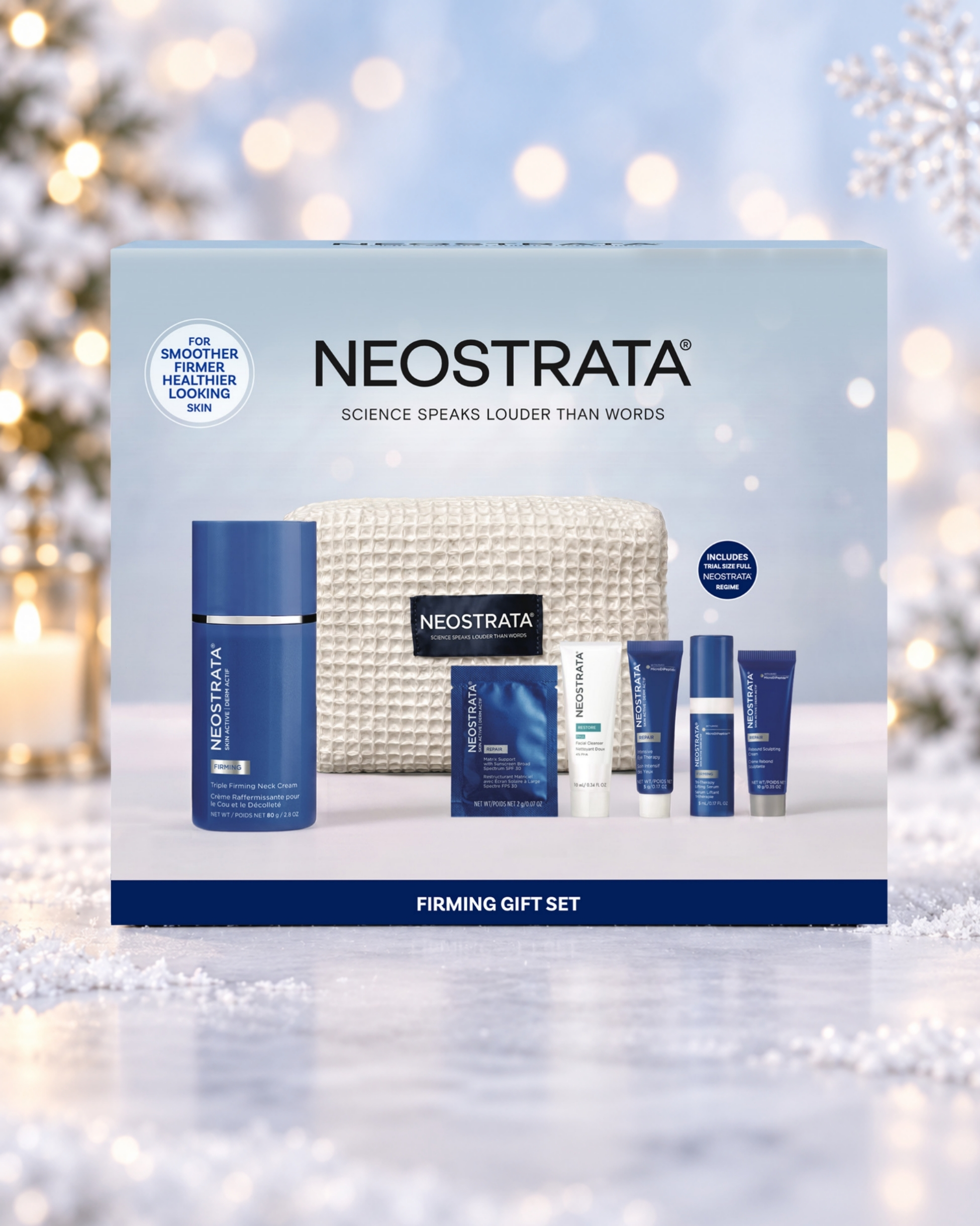 NEOSTRATA Firming Gift Set box against a snowy Christmas background with warm lights and a snowflake