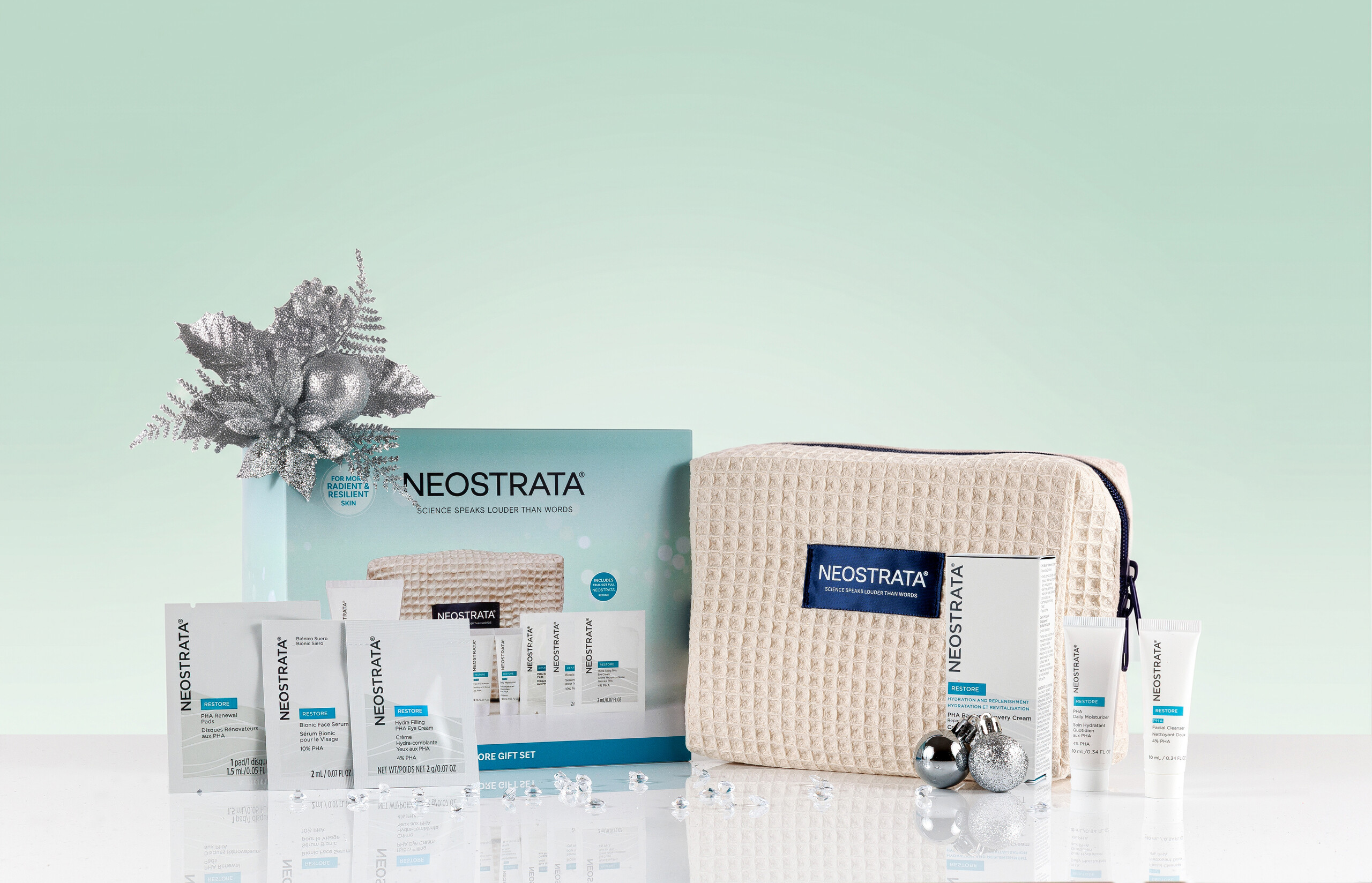 NEOSTRATA Restore Gift Set with skincare products, beauty bag and silver Christmas decorations
