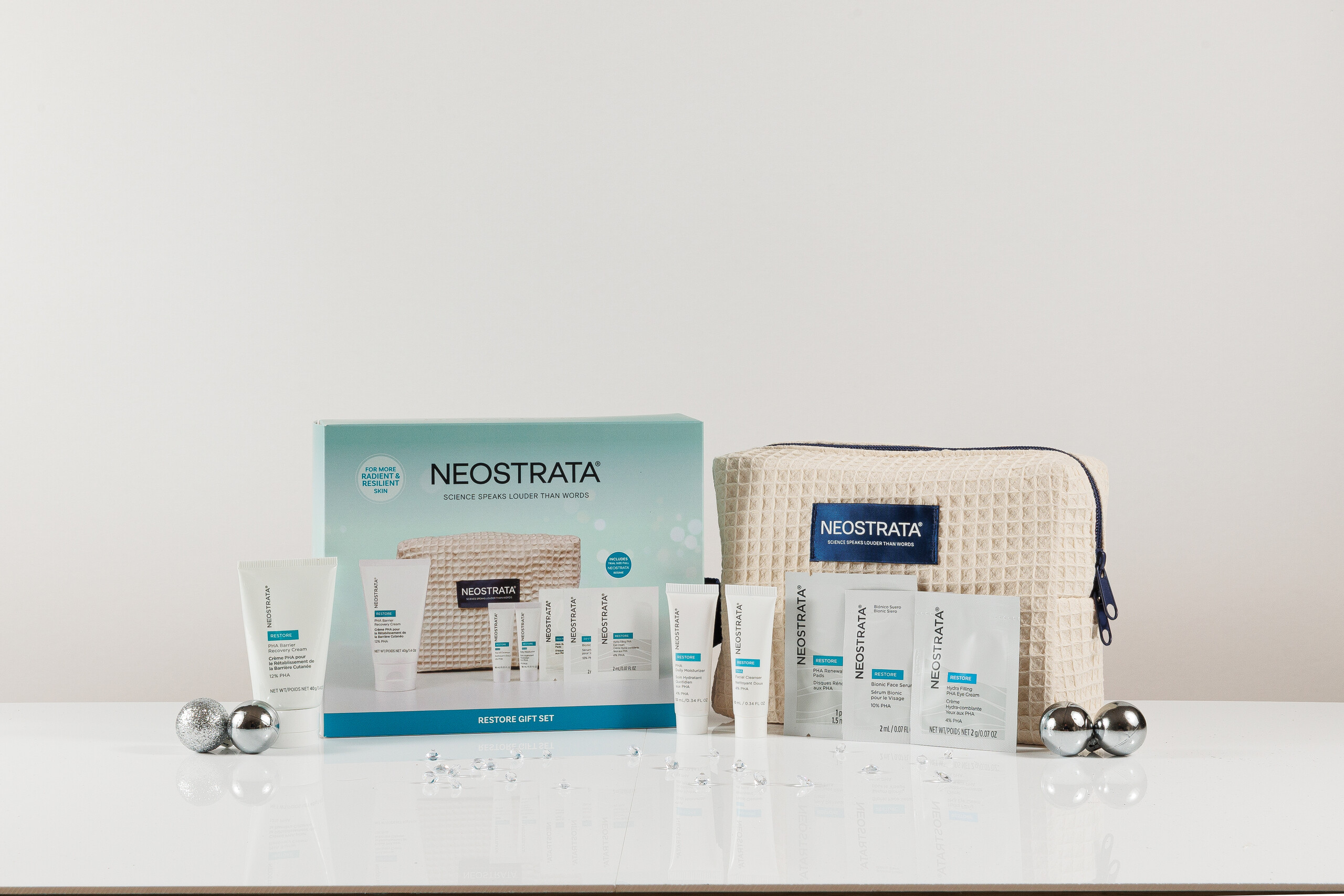 NEOSTRATA Restore Gift Set with included skincare products, cream beauty bag and gift box