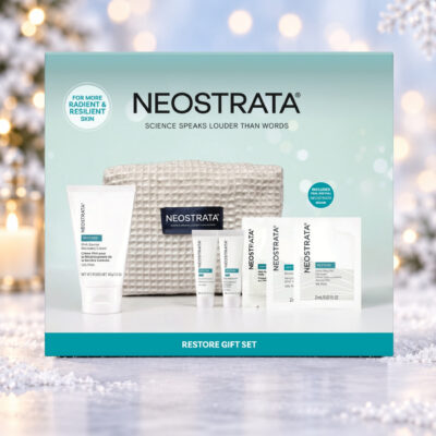 NEOSTRATA Restore Gift Set box against a snowy Christmas background with warm lights and a snowflake