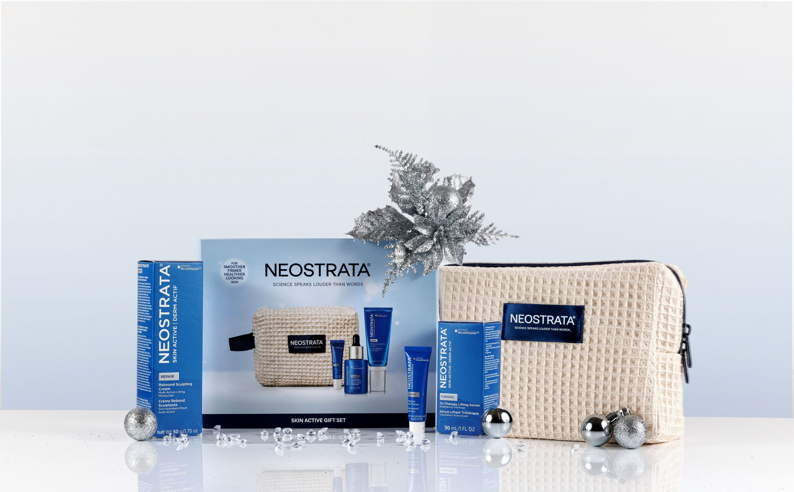 NEOSTRATA Skin Active Gift Set with skincare products, beauty bag and silver Christmas decorations