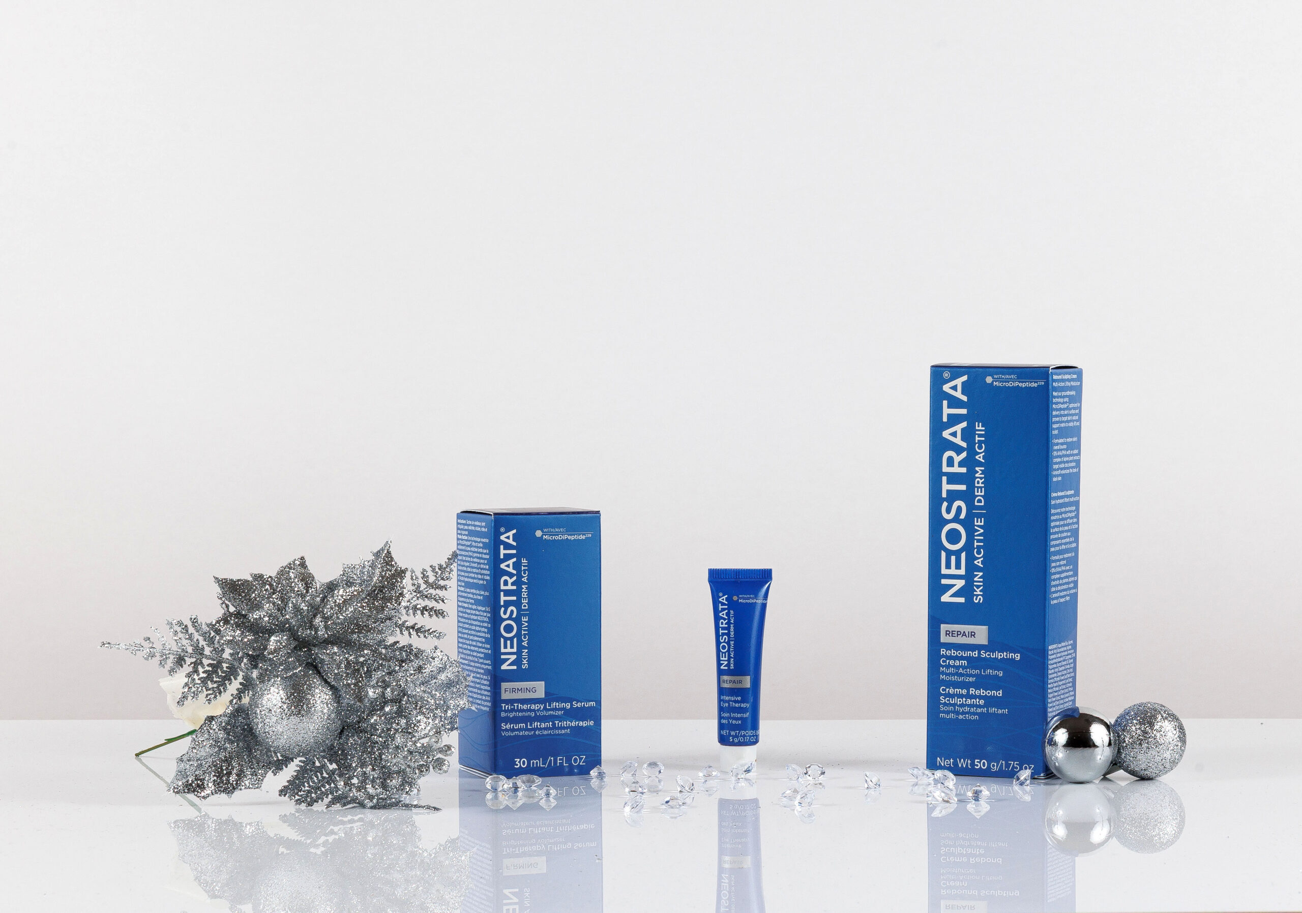 Tri-Therapy Lifting Serum 30ml, Intensive Eye Therapy 5g and Rebound Sculpting Cream 50g with Christmas decorations